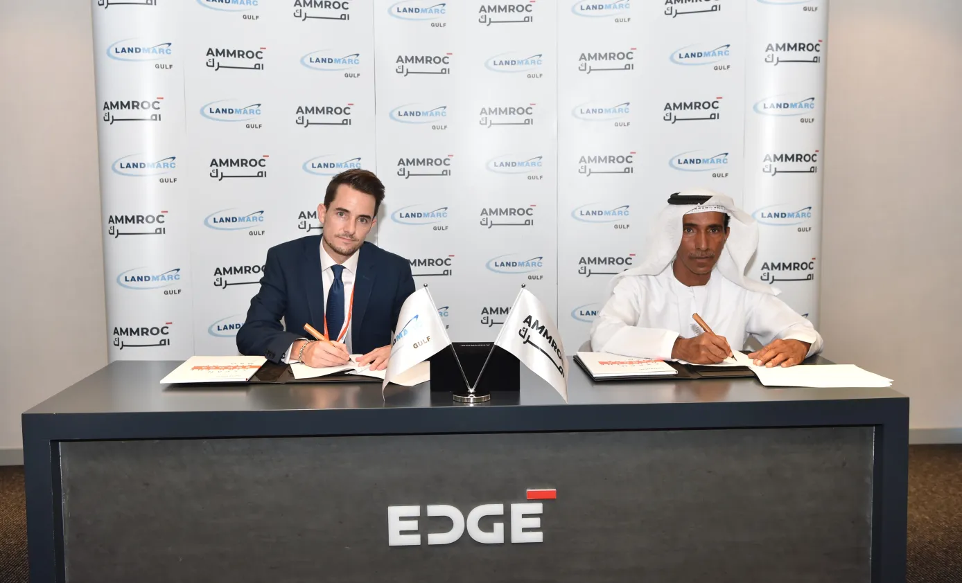 Hareb Al Dhaheri, CEO of AMMROC and Michael Jones, General Manager of Landmarc Gulf signs MoU at IDEX 2021 to enhance military training and support