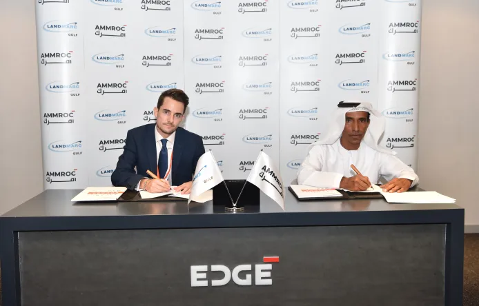 Hareb Al Dhaheri, CEO of AMMROC and Michael Jones, General Manager of Landmarc Gulf signs MoU at IDEX 2021 to enhance military training and support